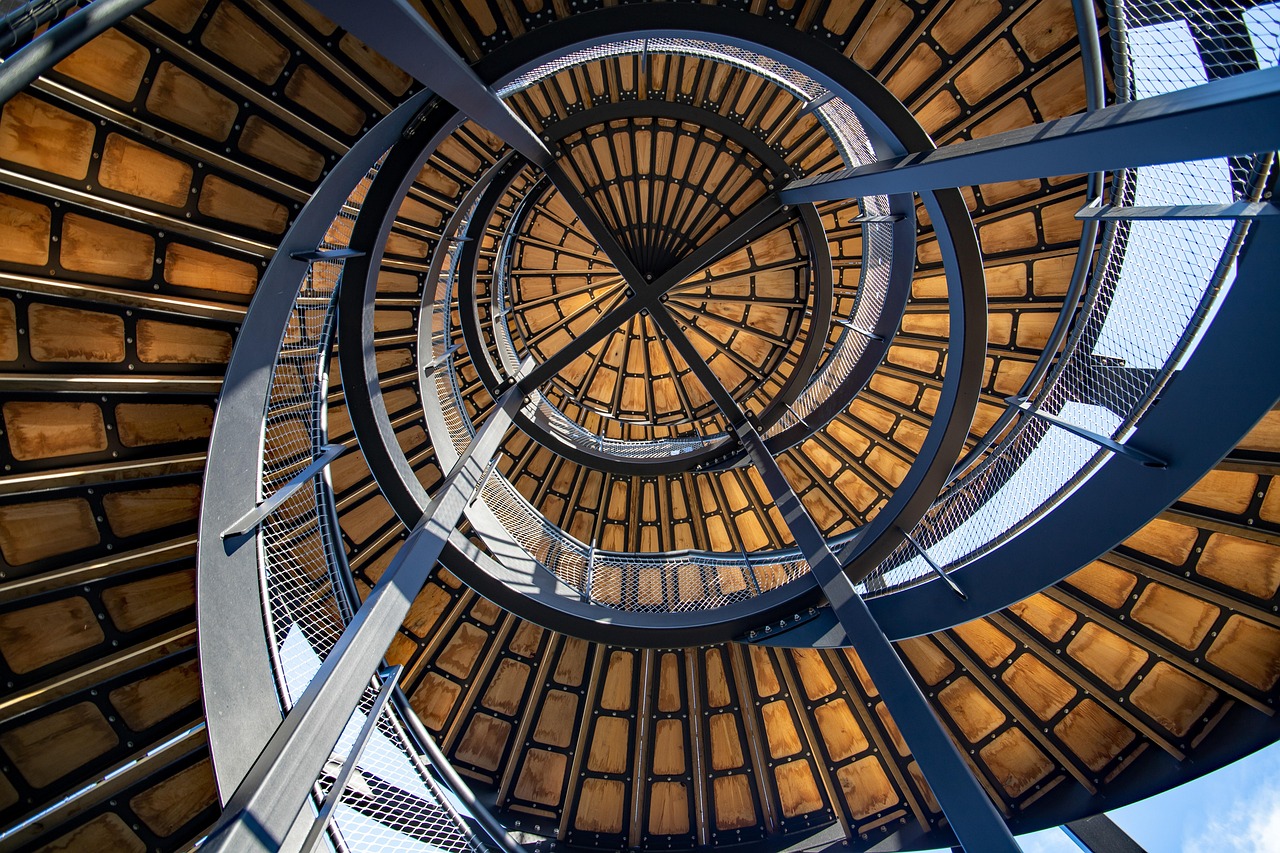 Architectural spiral staircase with steel and glass framing